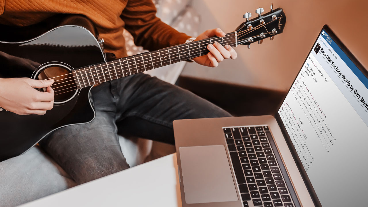 A person who has searched for online guitar chords and are playing them on a guitar